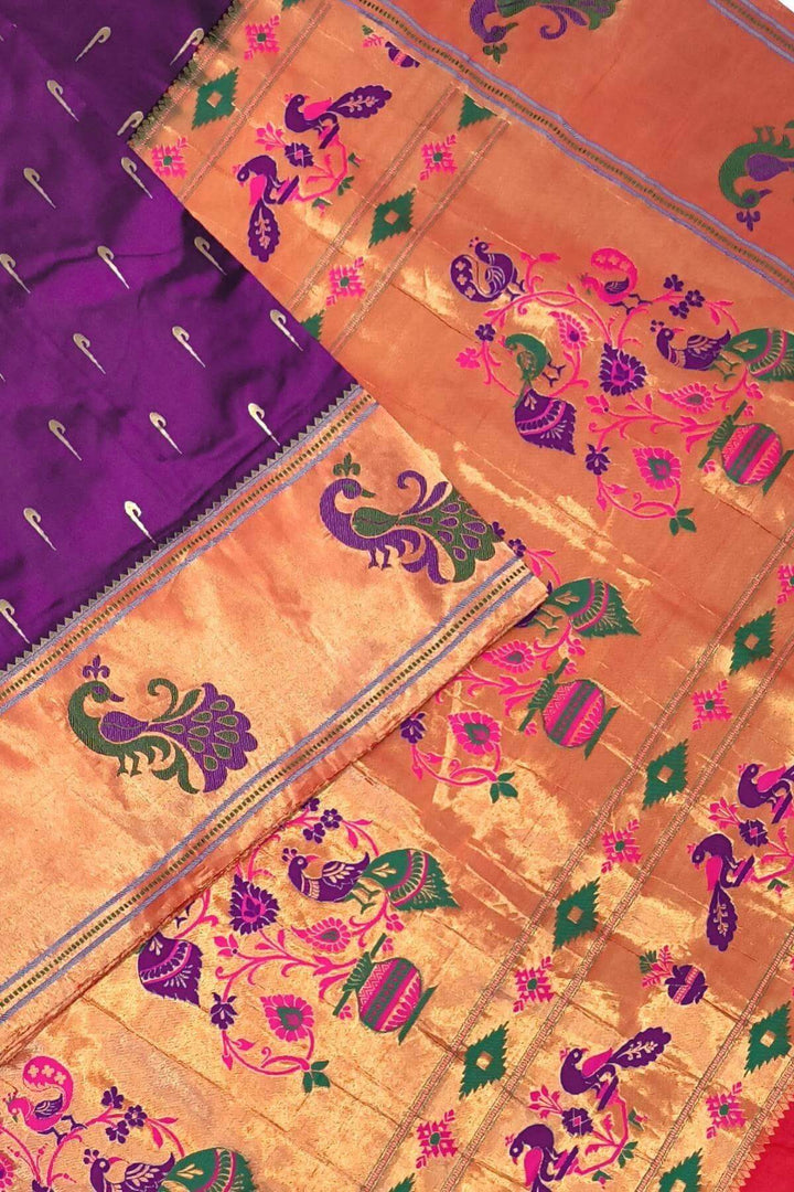 Paithani pure silk saree in wine with muniya motifs on the body.
