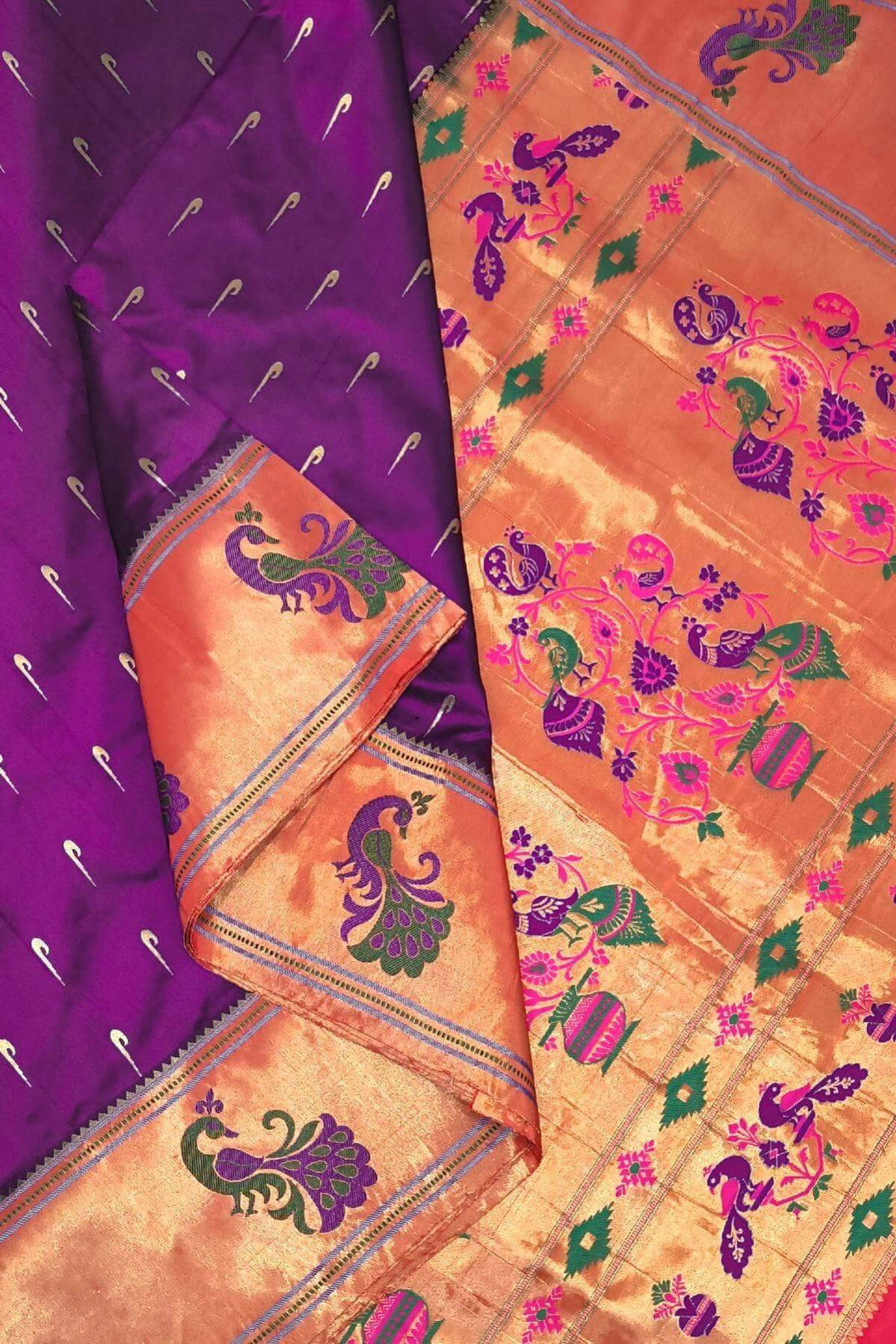 Paithani pure silk saree in wine with muniya motifs on the body.