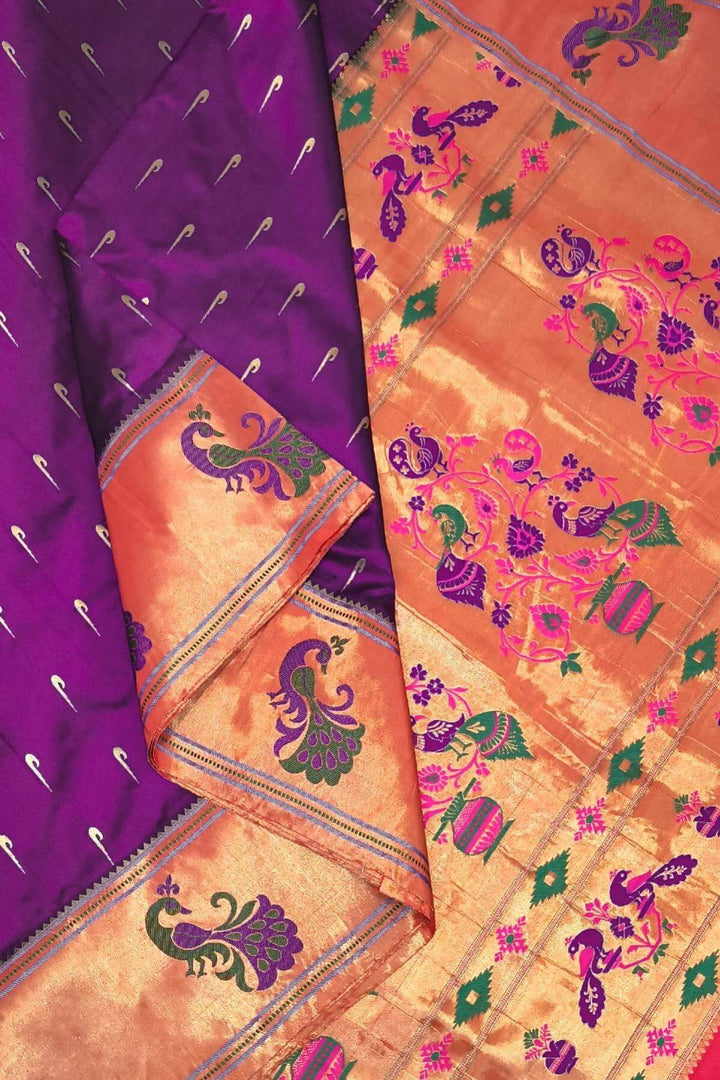 Paithani pure silk saree in wine with muniya motifs on the body.