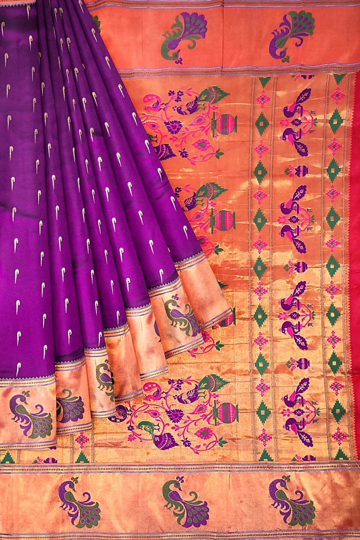 Paithani pure silk saree in wine with muniya motifs on the body.