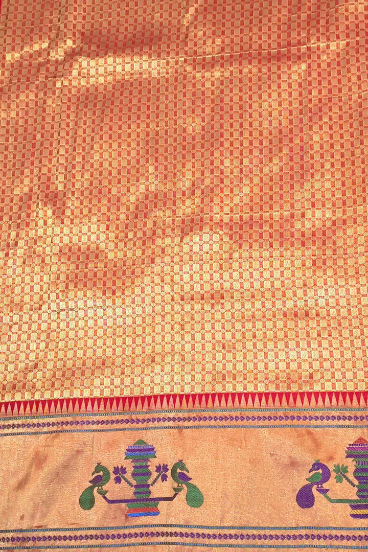 Paithani pure silk saree in purple with floral motifs on the body.