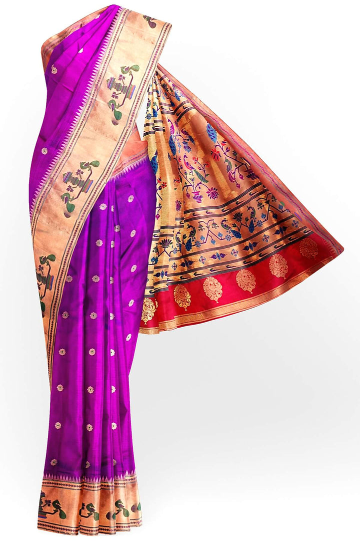 Paithani pure silk saree in purple with floral motifs on the body.