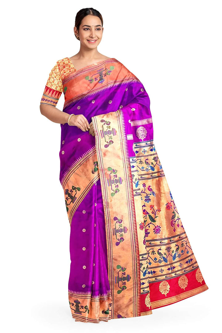 Paithani pure silk saree in purple with floral motifs on the body.