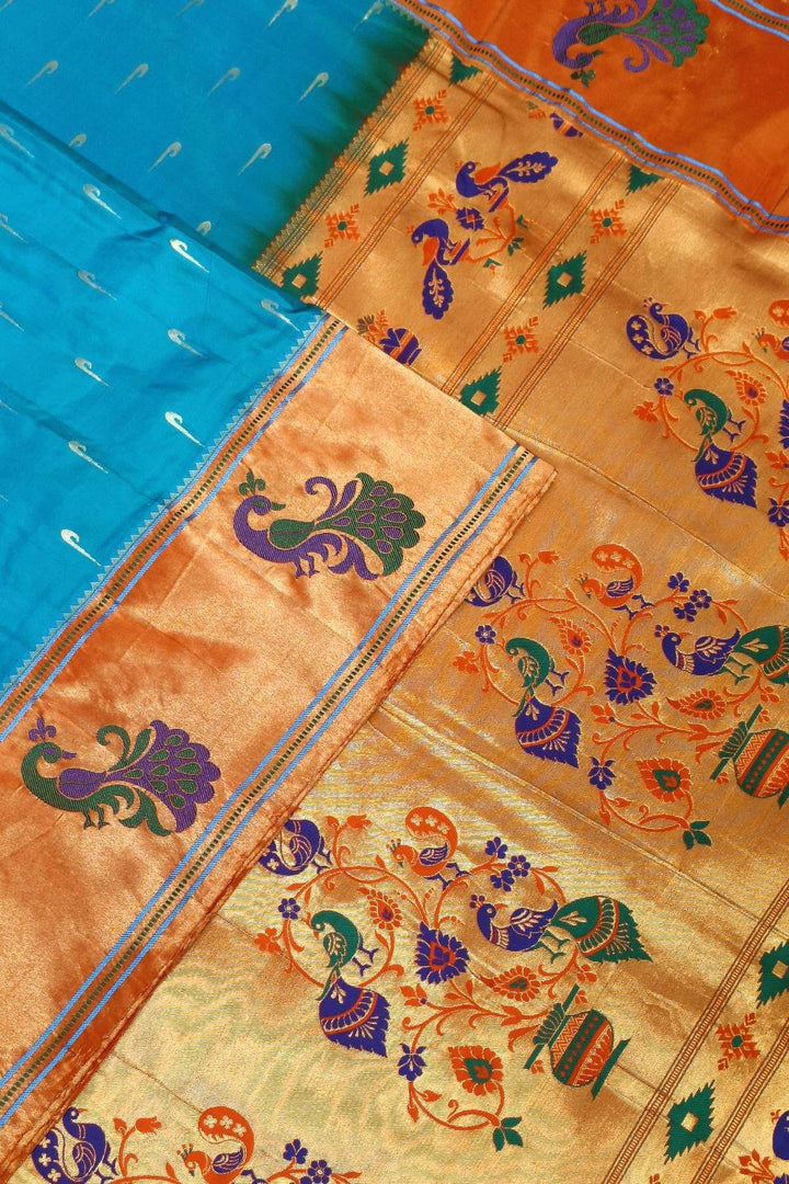 Paithani pure silk saree in blue with muniya motifs on the body.