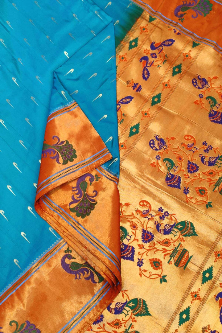 Paithani pure silk saree in blue with muniya motifs on the body.