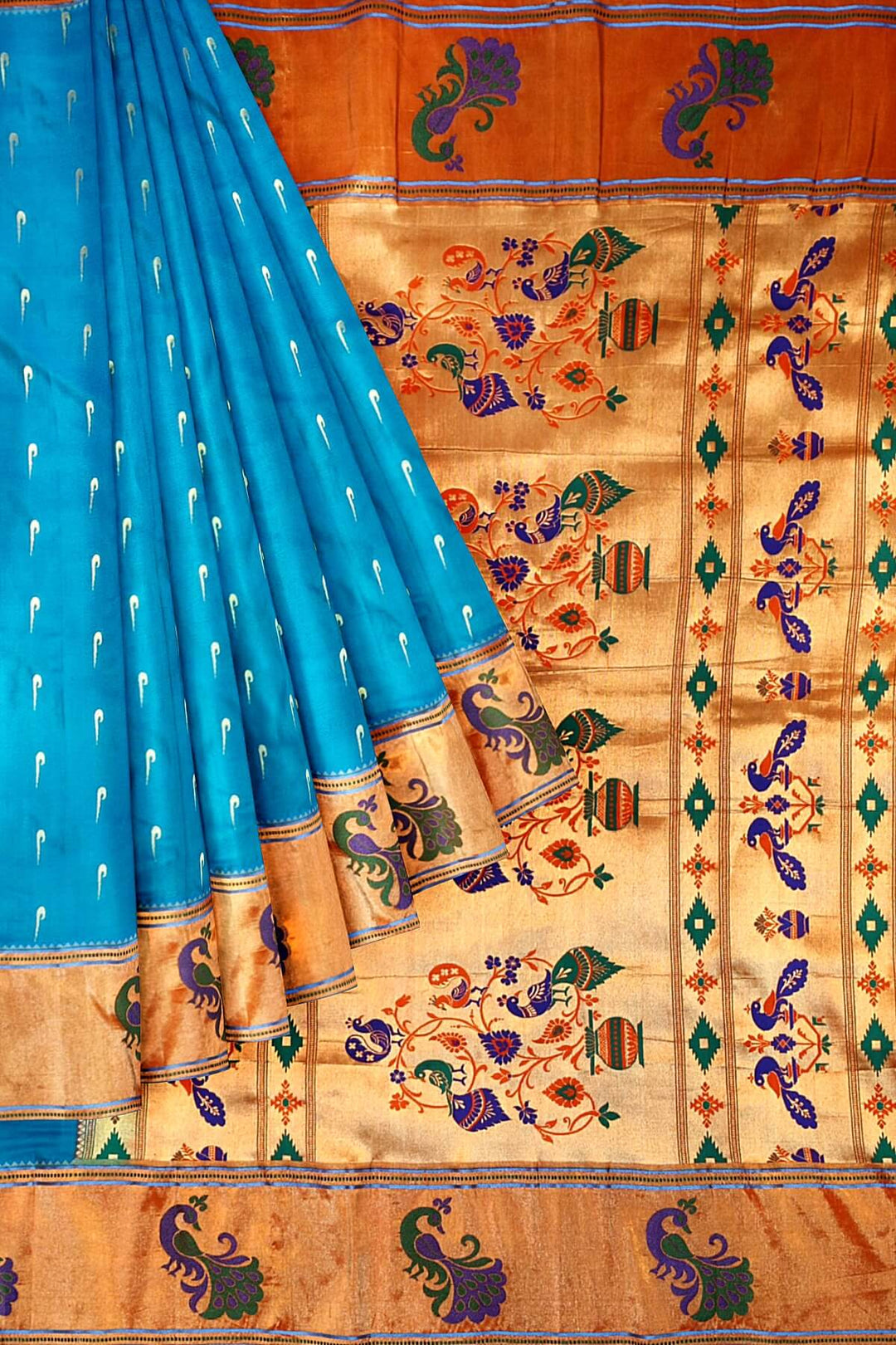 Paithani pure silk saree in blue with muniya motifs on the body.
