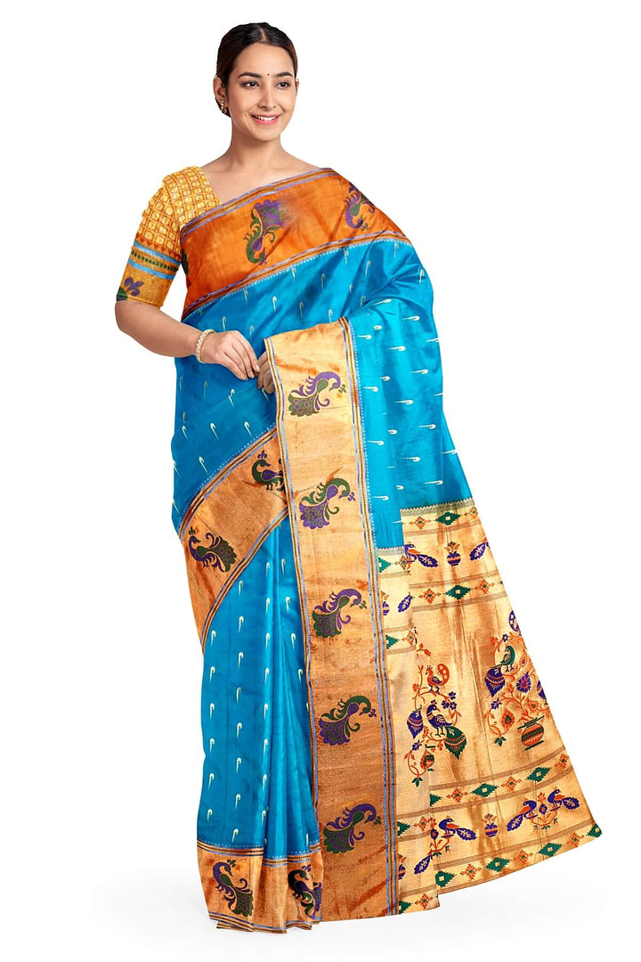 Paithani pure silk saree in blue with muniya motifs on the body.