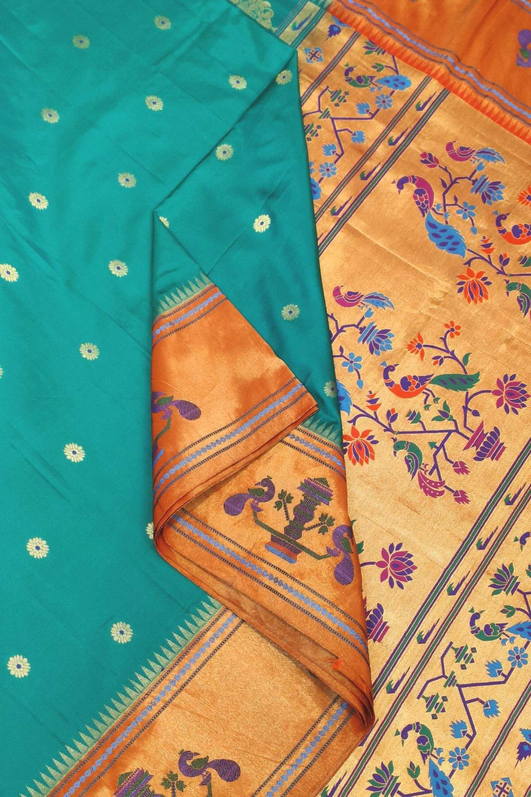Paithani pure silk saree in green with with round buttis with meena work.