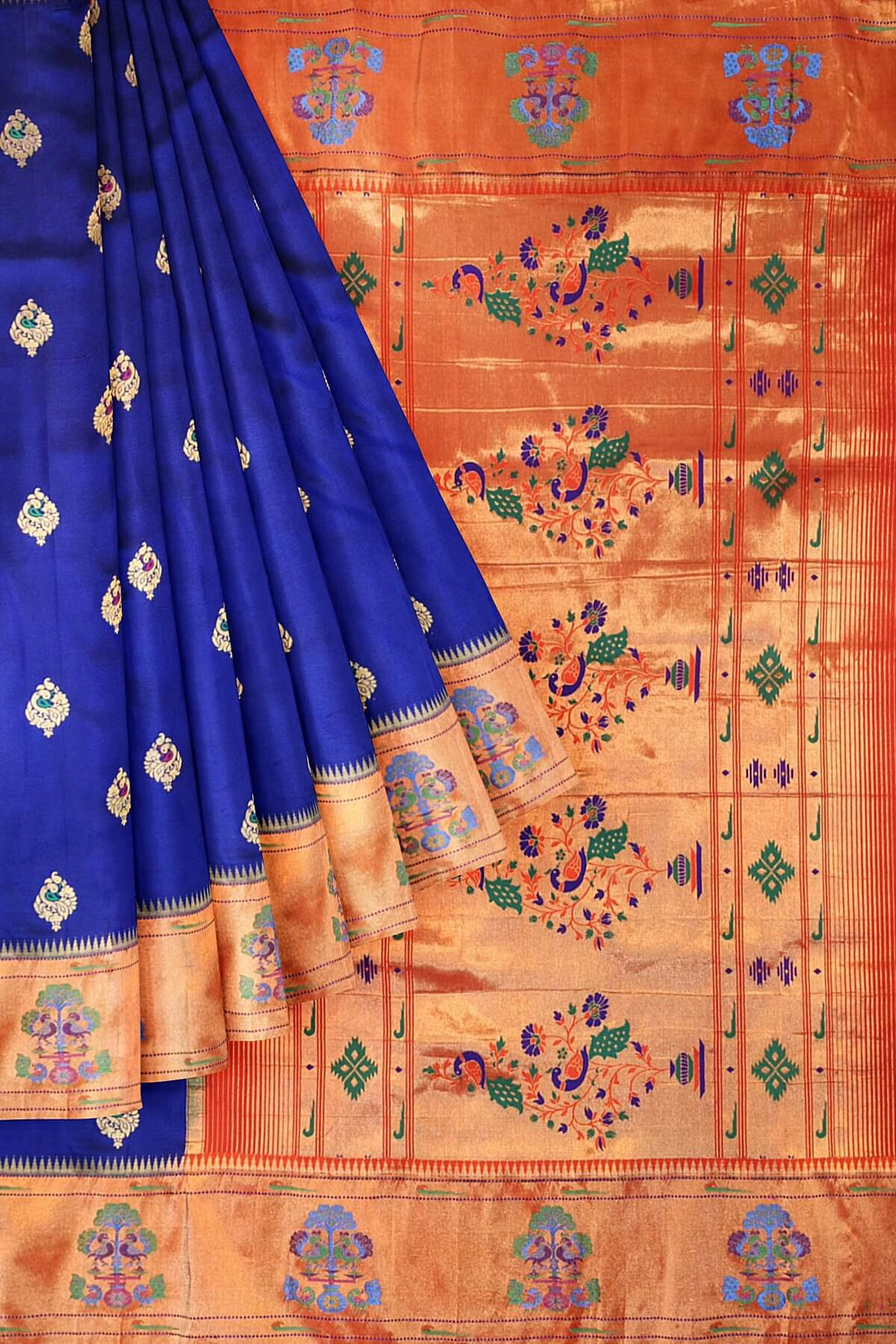 Paithani pure silk saree in violet with peacock motifs on the body.