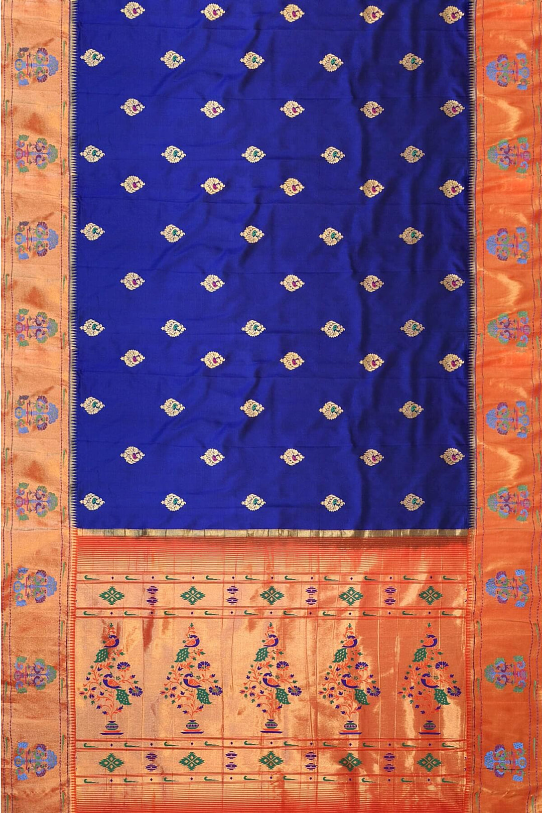 Paithani pure silk saree in violet with peacock motifs on the body.