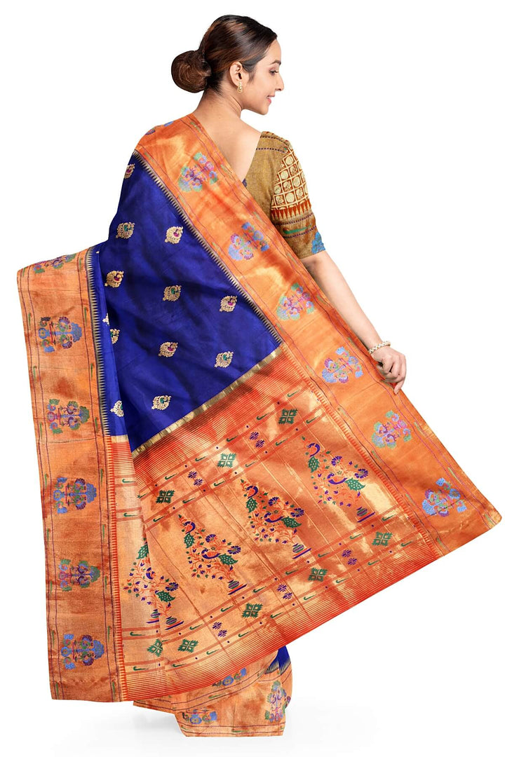 Paithani pure silk saree in violet with peacock motifs on the body.