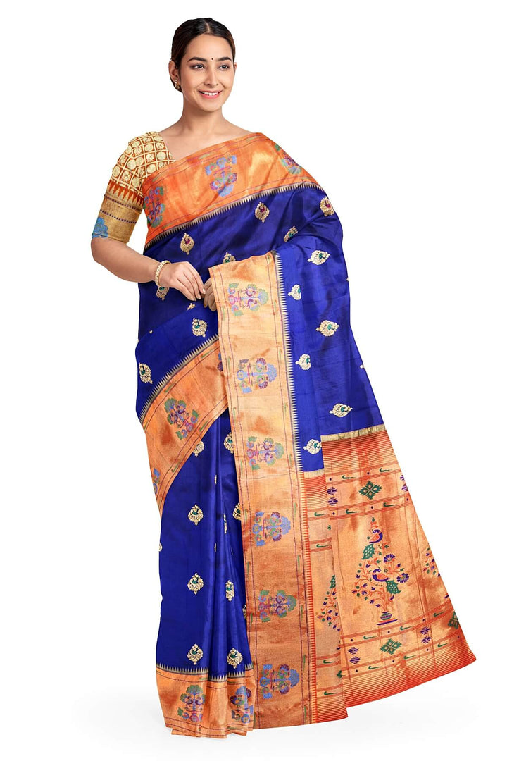 Paithani pure silk saree in violet with peacock motifs on the body.