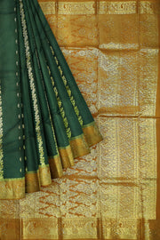 Kora silk saree in green with  floral motifs in gold