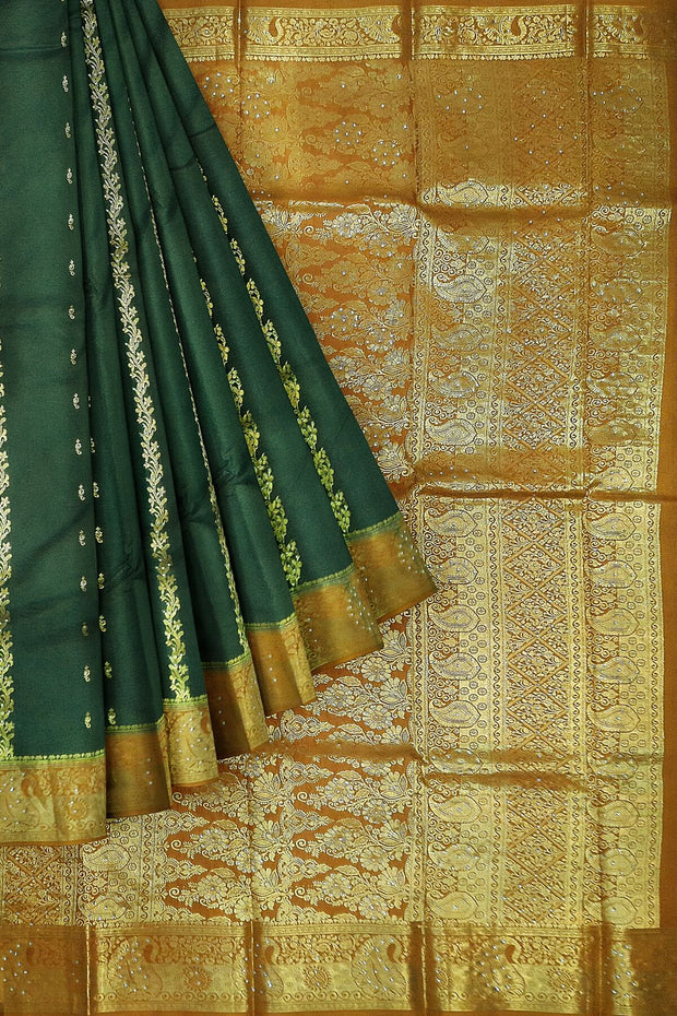 Kora silk saree in green with  floral motifs in gold