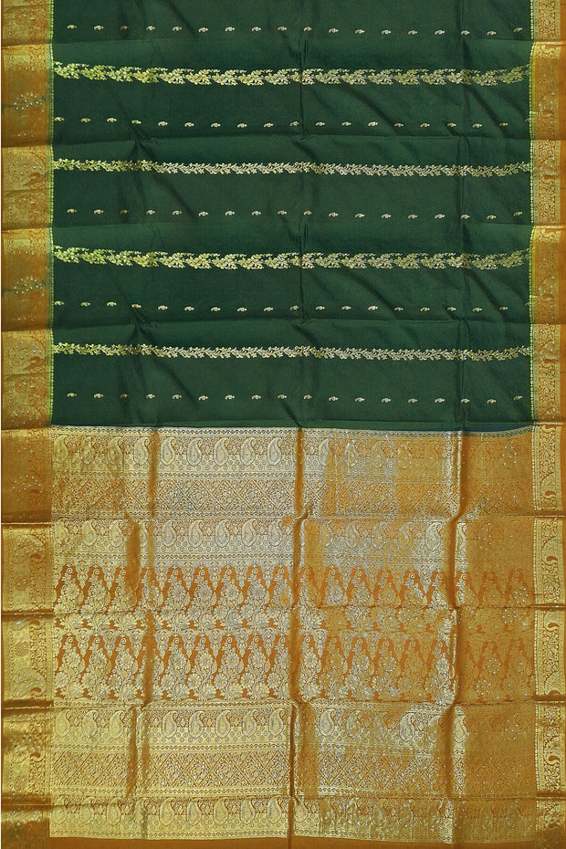 Kora silk saree in green with  floral motifs in gold