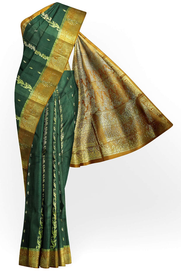 Kora silk saree in green with  floral motifs in gold