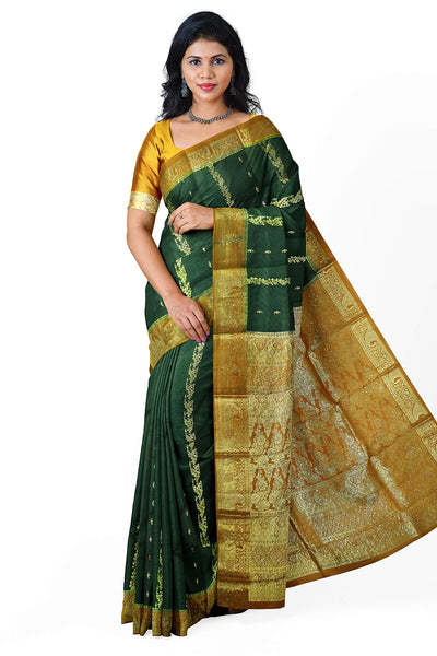 Kora silk saree in green with  floral motifs in gold