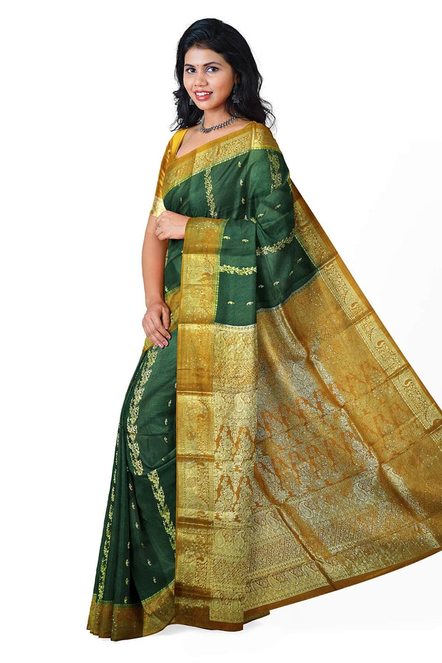 Kora silk saree in green with  floral motifs in gold