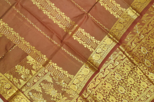 Kora silk saree in coffee brown with  floral motifs in gold