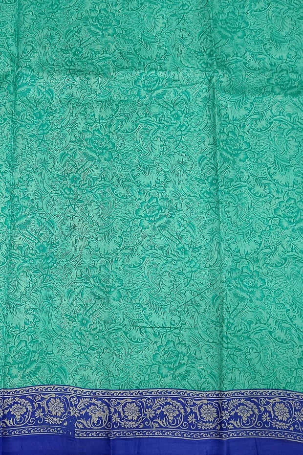 Printed pure silk saree in teal blue