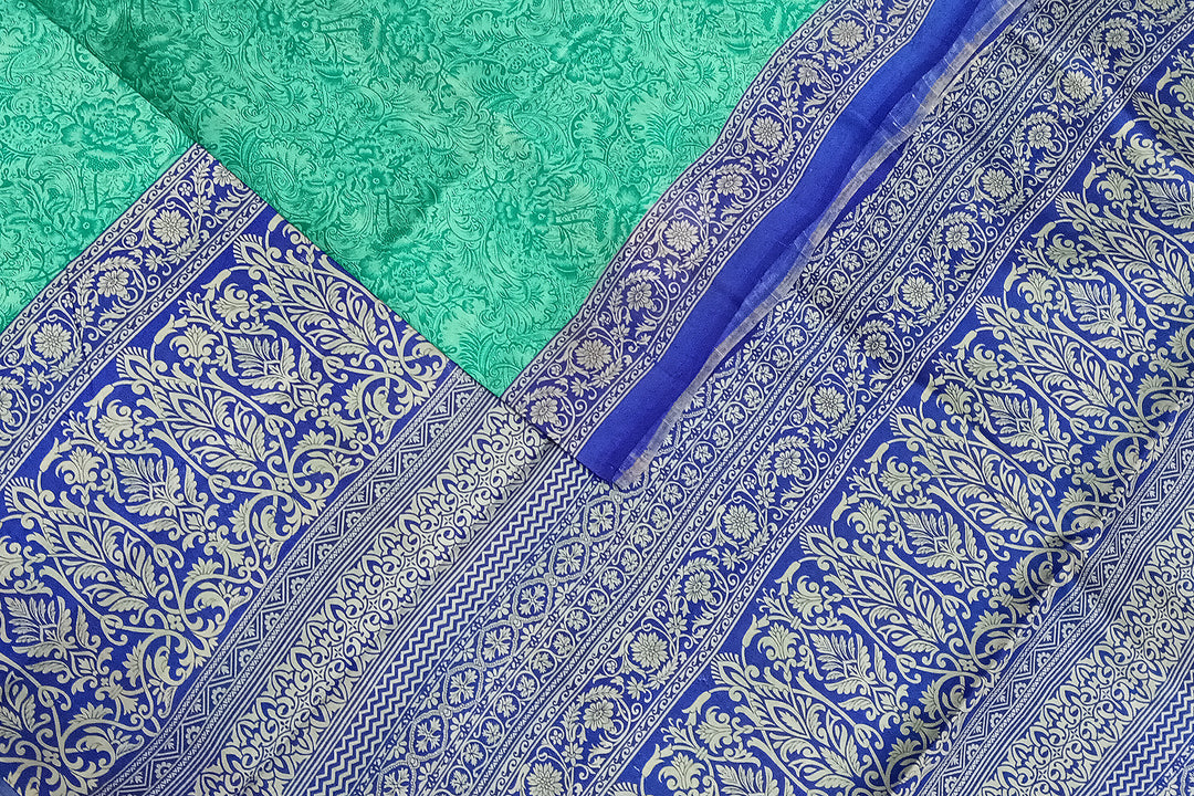 Printed pure silk saree in teal blue