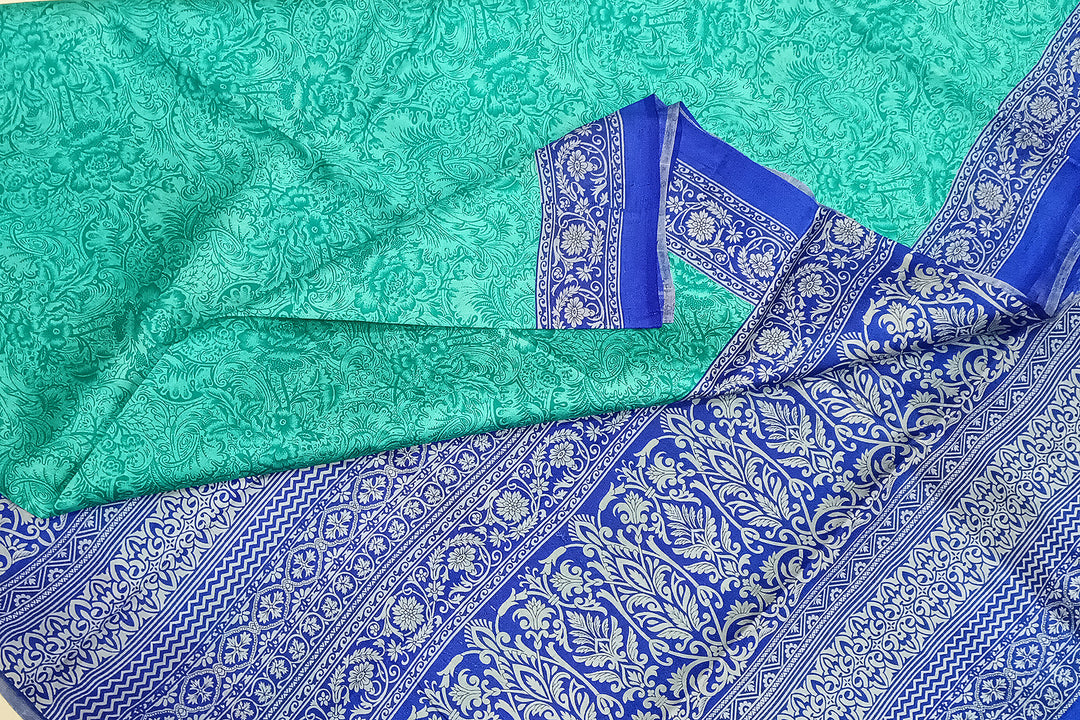 Printed pure silk saree in teal blue