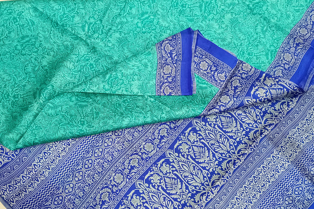 Printed pure silk saree in teal blue