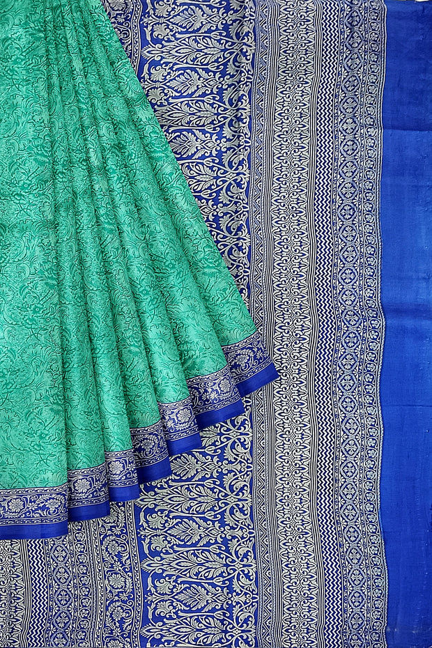 Printed pure silk saree in teal blue