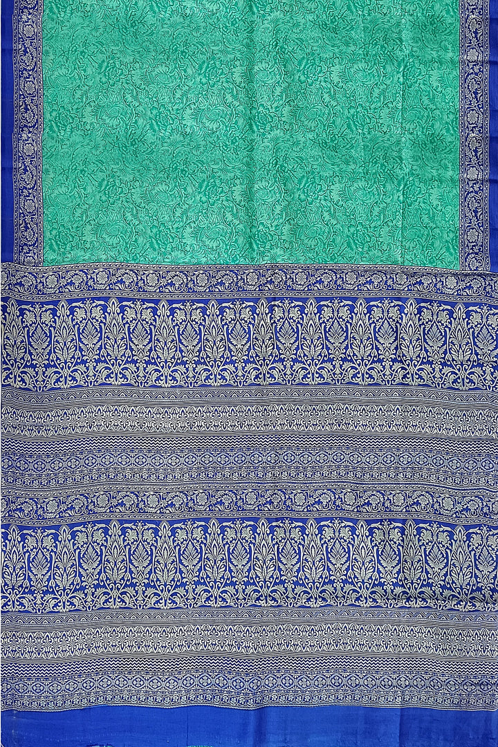 Printed pure silk saree in teal blue