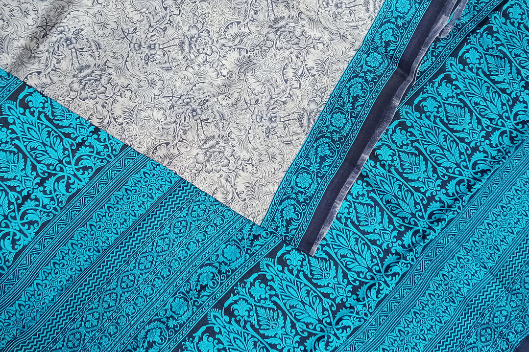 Printed pure silk saree in bluish grey in floral pattern