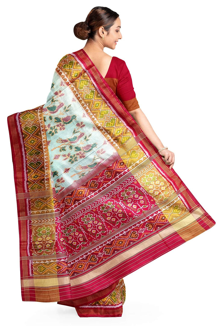 Handwoven Patola  pure silk saree in  off white with bird motifs and a contrast pallu .