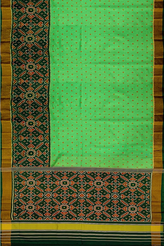 Handwoven Patola pure silk saree in green with small motifs and a skirt border