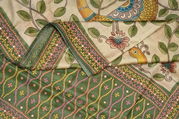 Hand painted kalamkari on  tussar silk saree in off white  with kutch embroidery