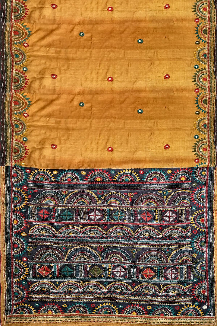 Lambani hand embroidery  on Tussar pure silk saree in mustard