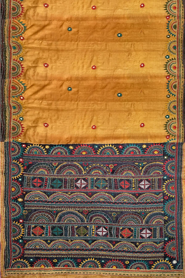 Lambani hand embroidery  on Tussar pure silk saree in mustard