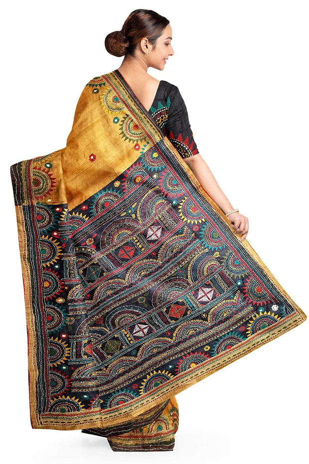 Lambani hand embroidery  on Tussar pure silk saree in mustard