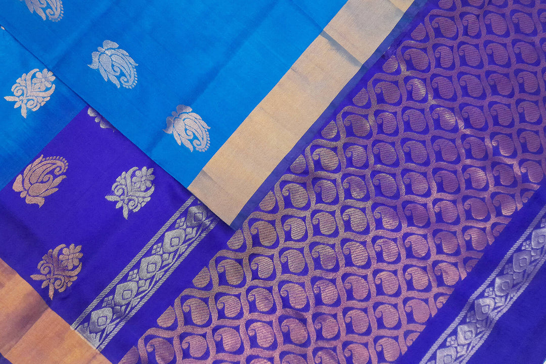 Handwoven Uppada pure silk saree in torquoise blue with floral motifs in gold & silver.