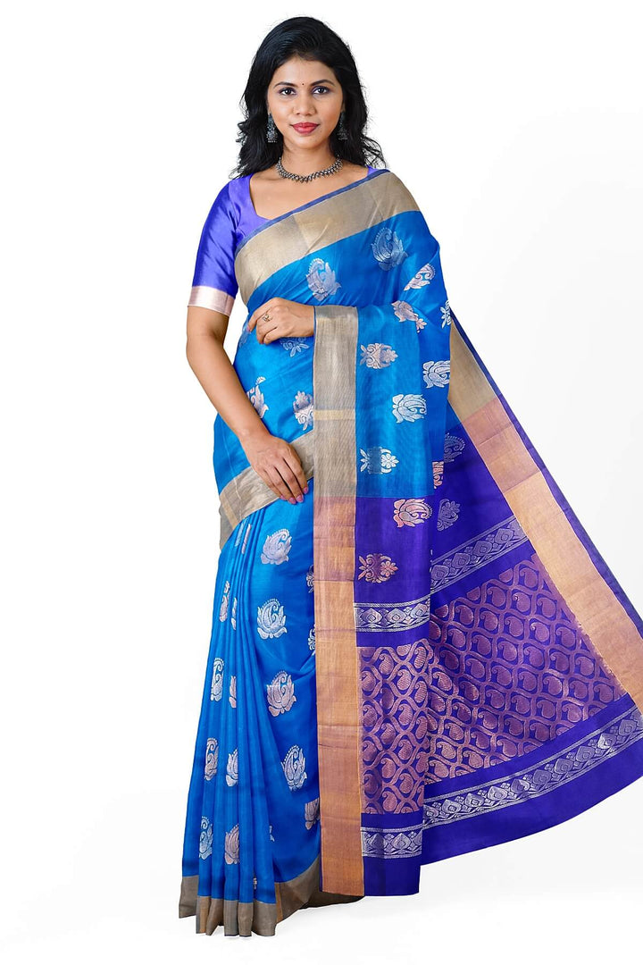 Handwoven Uppada pure silk saree in torquoise blue with floral motifs in gold & silver.