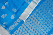 Handwoven Uppada pure silk saree in copper sulphate blue with floral motifs in silver.