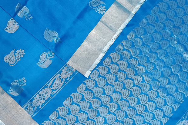 Handwoven Uppada pure silk saree in copper sulphate blue with floral motifs in silver.