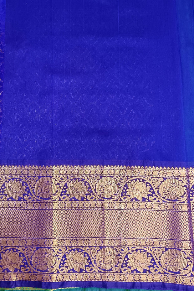 Handwoven Uppada pure silk saree In light green with gold & silver motifs.