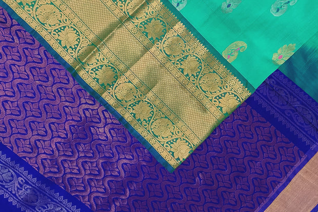 Handwoven Uppada pure silk saree In light green with gold & silver motifs.