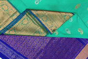 Handwoven Uppada pure silk saree In light green with gold & silver motifs.