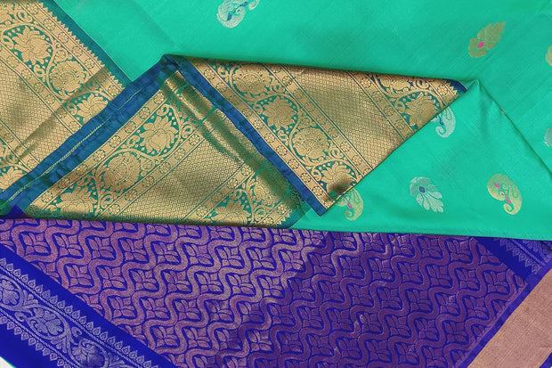 Handwoven Uppada pure silk saree In light green with gold & silver motifs.