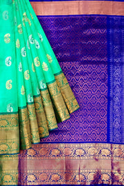 Handwoven Uppada pure silk saree In light green with gold & silver motifs.