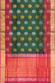 Handwoven Uppada pure silk saree in bottle green with gold & silver motifs .