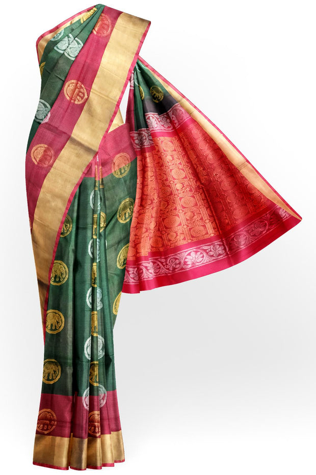 Handwoven Uppada pure silk saree in bottle green with gold & silver motifs .