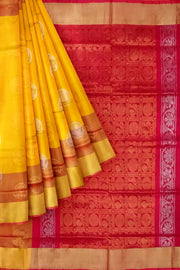 Handwoven Uppada pure silk saree in yellow with gold & silver motifs .