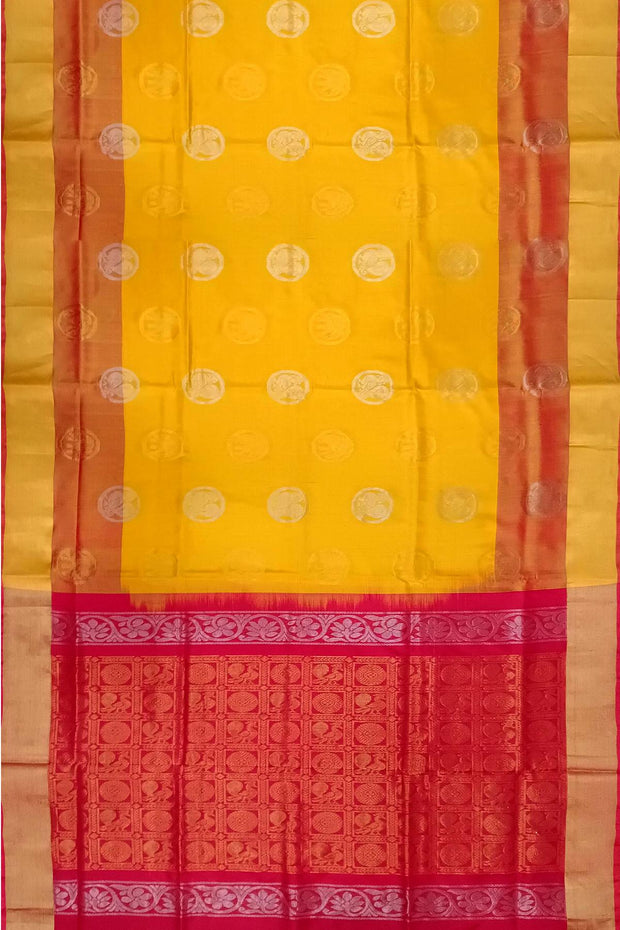 Handwoven Uppada pure silk saree in yellow with gold & silver motifs .