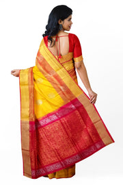 Handwoven Uppada pure silk saree in yellow with gold & silver motifs .